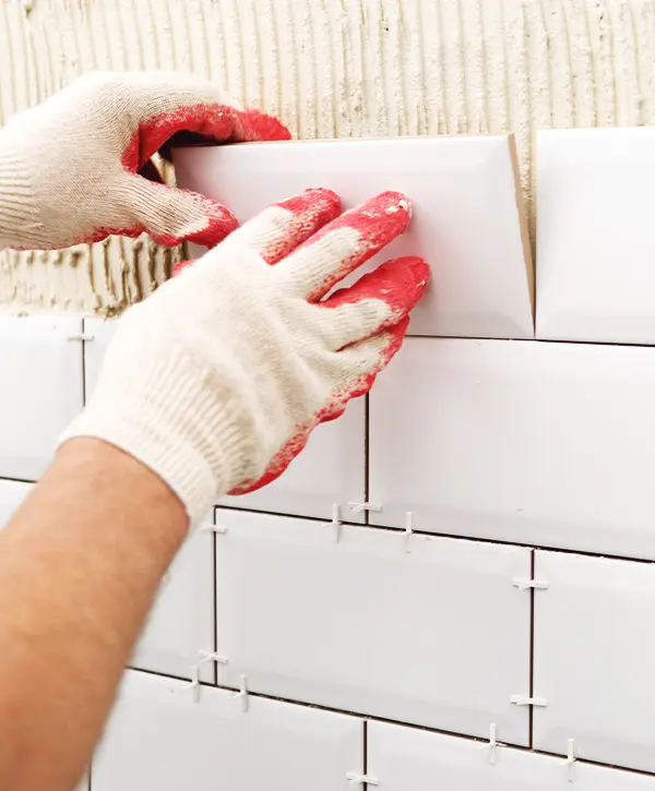 worker from baileys remodeling installing tile