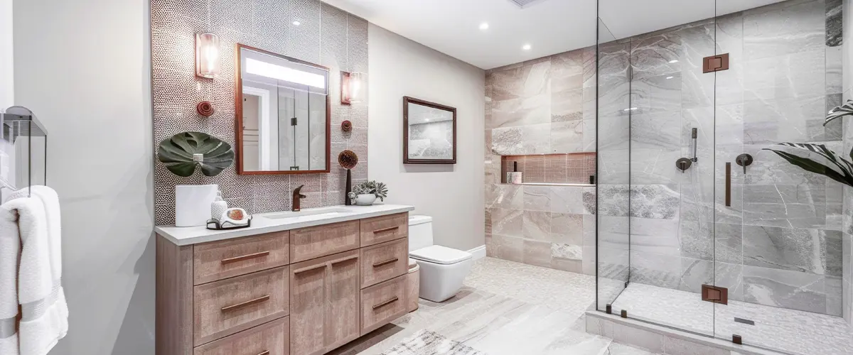 Elegant bathroom with wooden vanity, glass shower, and modern lighting fixtures