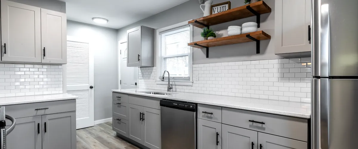 Modern kitchen with gray cabinets and stainless steel appliances